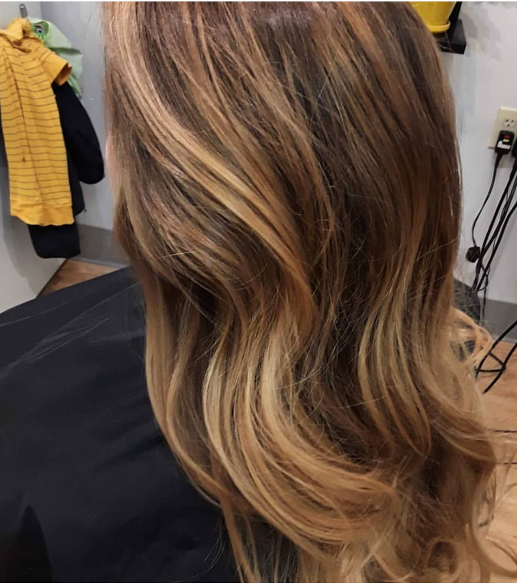 Styled long brown hair with highlights
